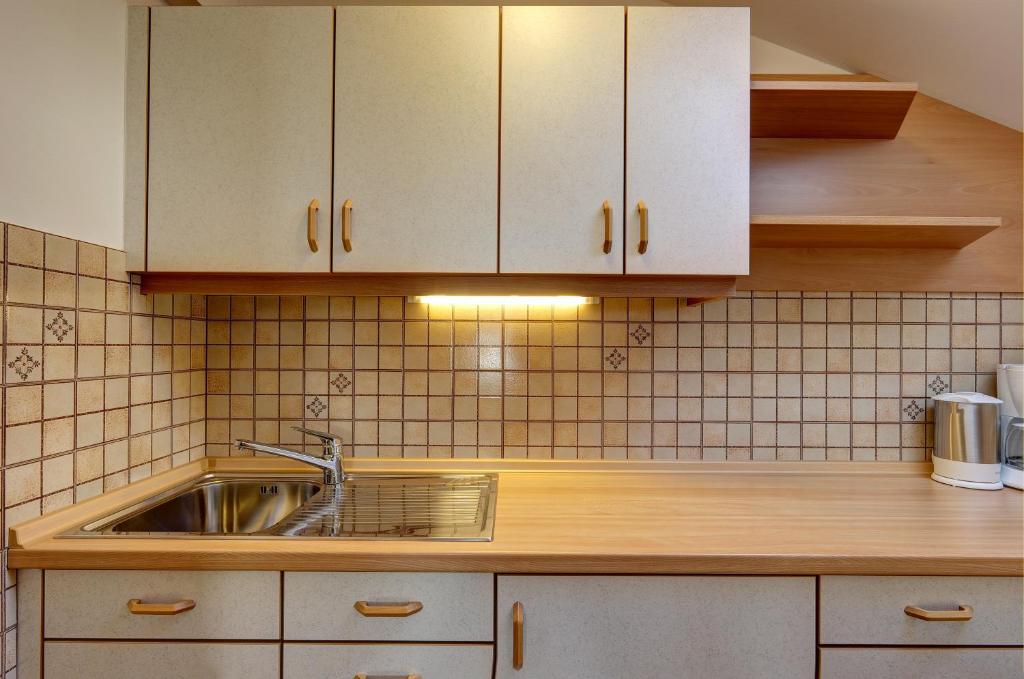 Kuchyň nebo kuchyňský kout v ubytování Apartments Schneider