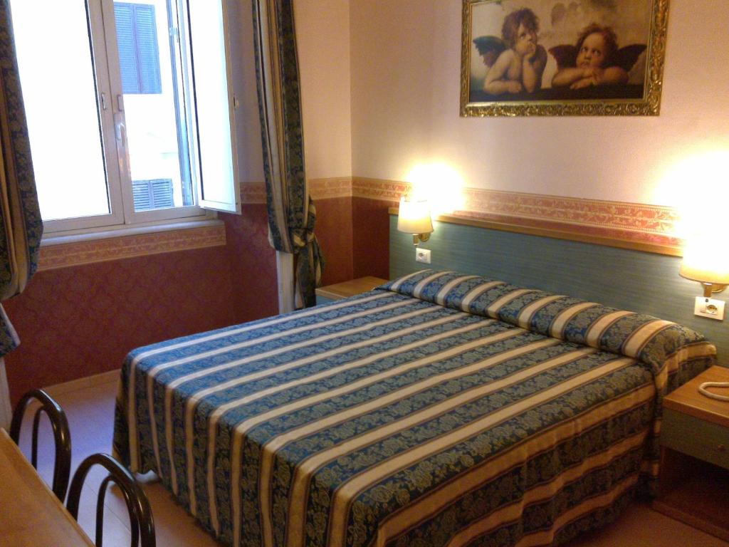 Postel nebo postele na pokoji v ubytování Hotel Lazzari