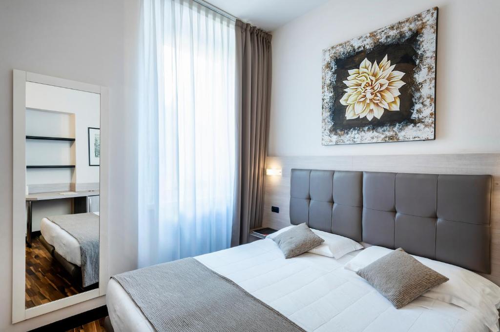 Postel nebo postele na pokoji v ubytování Hotel Asnigo