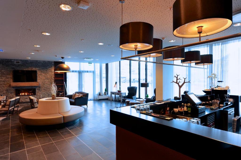 a lobby with a bar in a building at Myrkdalen Resort Hotel in Myrkdalen
