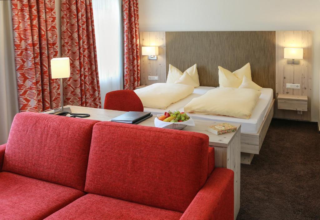 Postel nebo postele na pokoji v ubytování Rüters Parkhotel