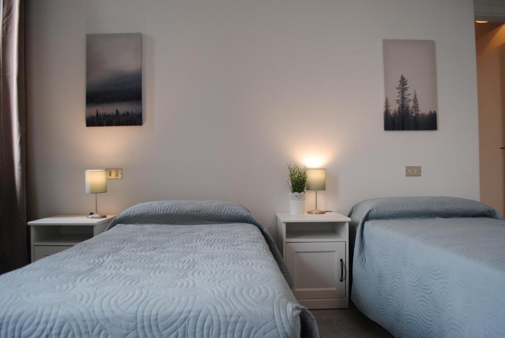 Postel nebo postele na pokoji v ubytování Bnbook Cascina Crennese