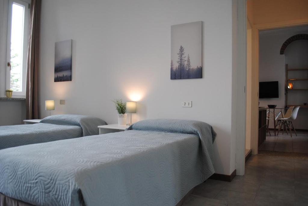 Postel nebo postele na pokoji v ubytování Bnbook Cascina Crennese