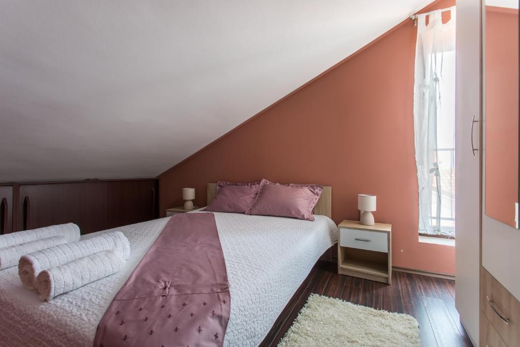 Postel nebo postele na pokoji v ubytování Apartments TB