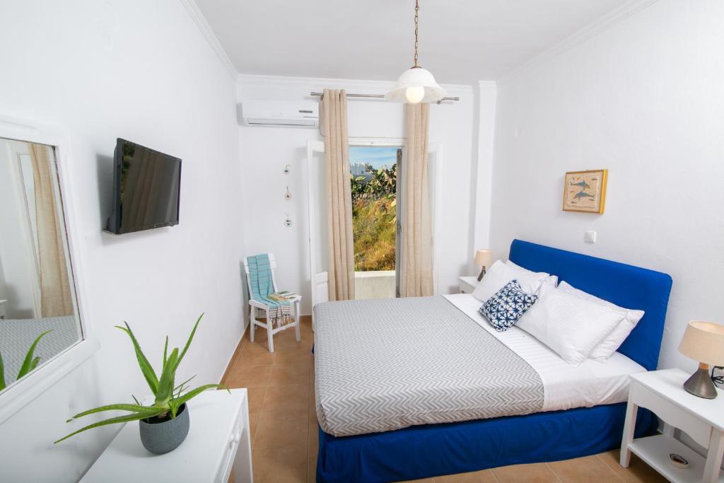 Postel nebo postele na pokoji v ubytování Caldera Sunset Villa