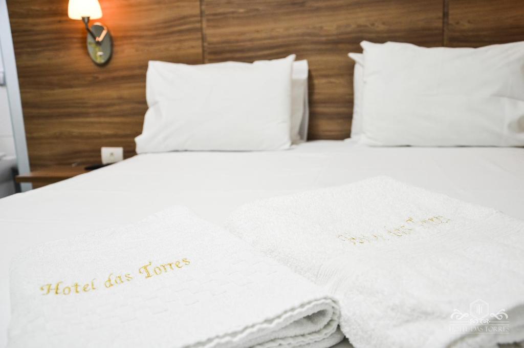 Postel nebo postele na pokoji v ubytování Hotel das Torres