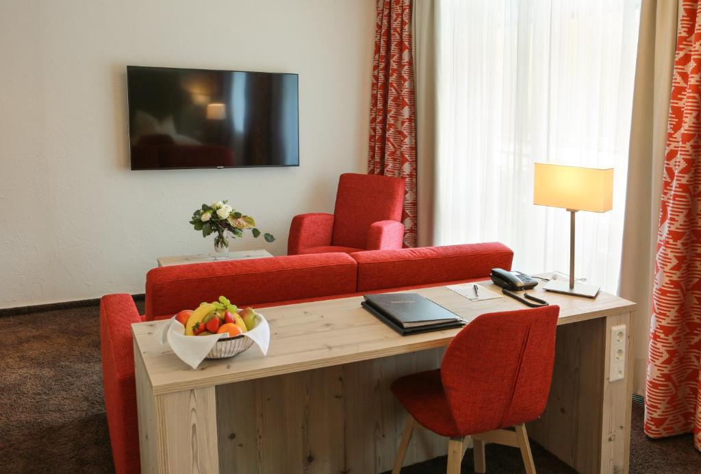 TV a/nebo společenská místnost v ubytování Rüters Parkhotel