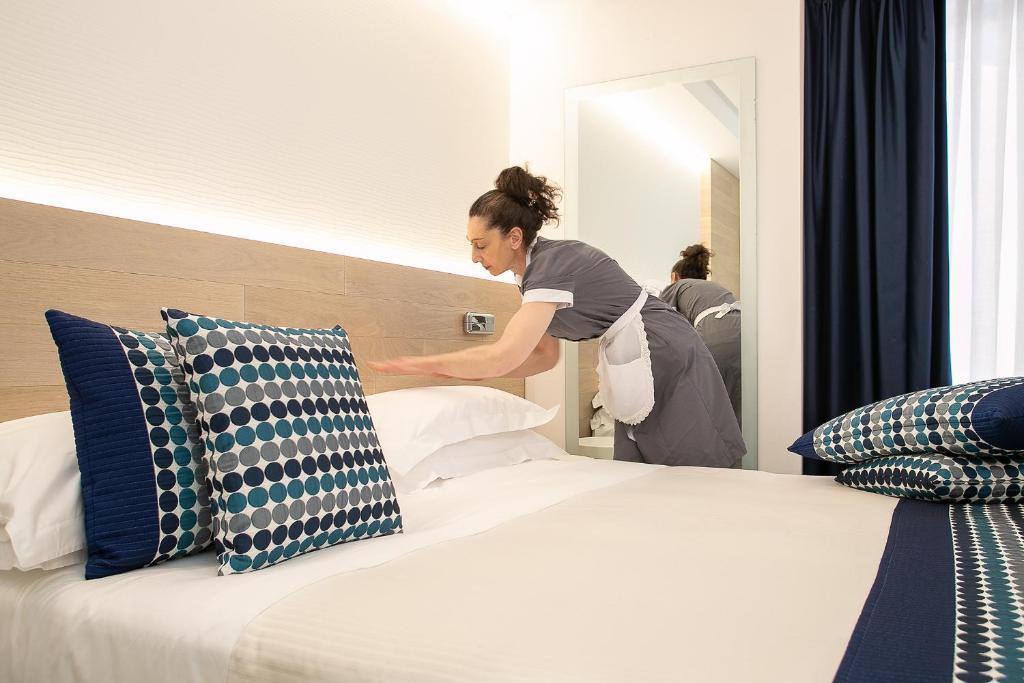 Postel nebo postele na pokoji v ubytování Hotel Daniele