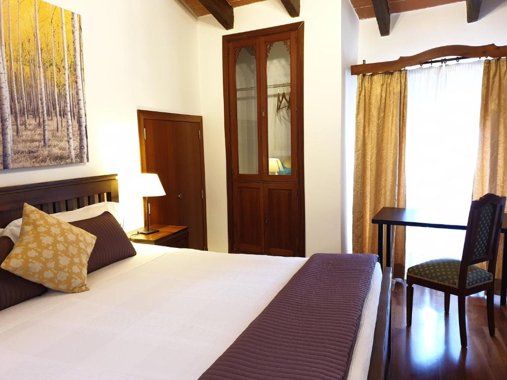 Postel nebo postele na pokoji v ubytování Hotel Segles - Turismo de Interior