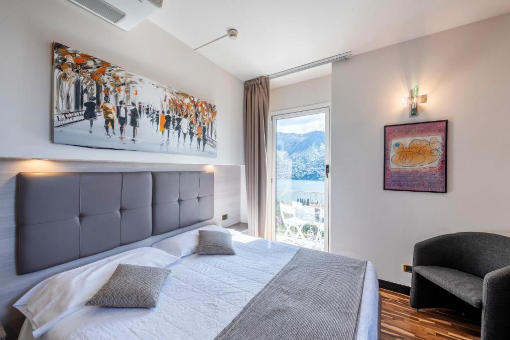Postel nebo postele na pokoji v ubytování Hotel Asnigo