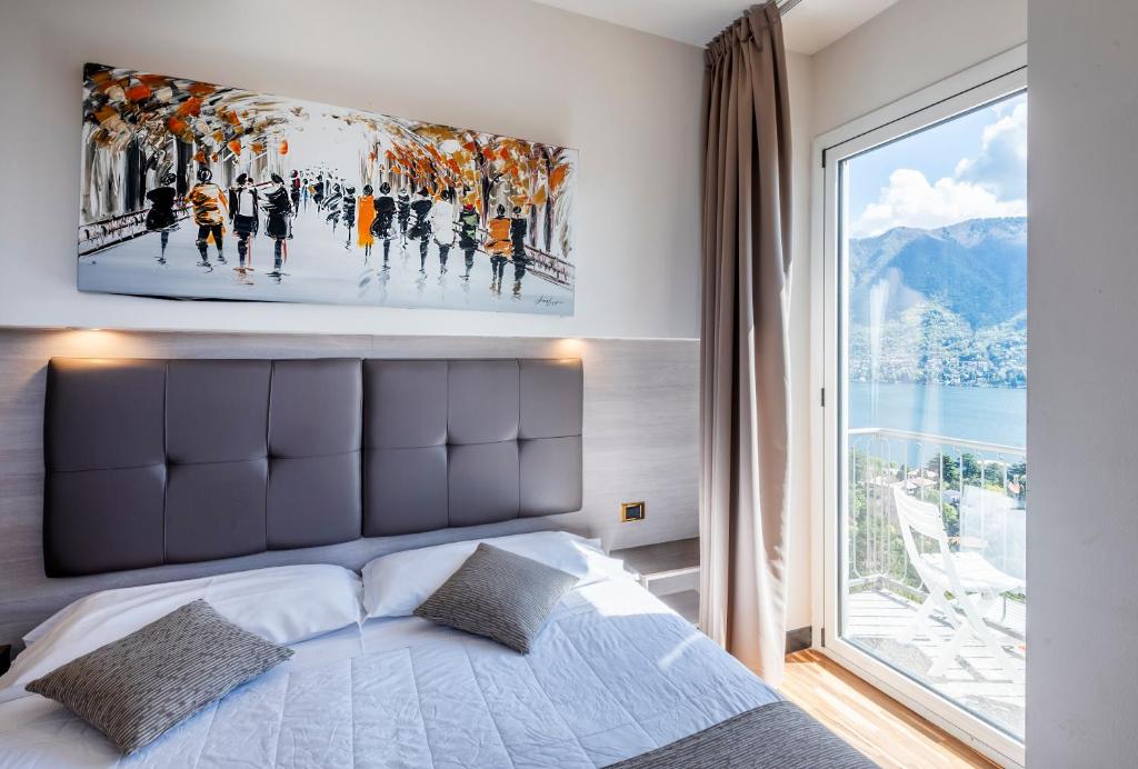 Postel nebo postele na pokoji v ubytování Hotel Asnigo