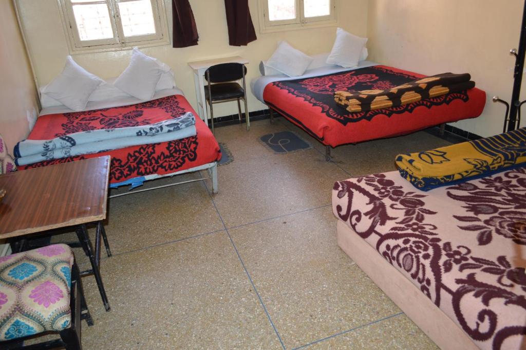 Postel nebo postele na pokoji v ubytování Hotel Atlas Ouarzazate