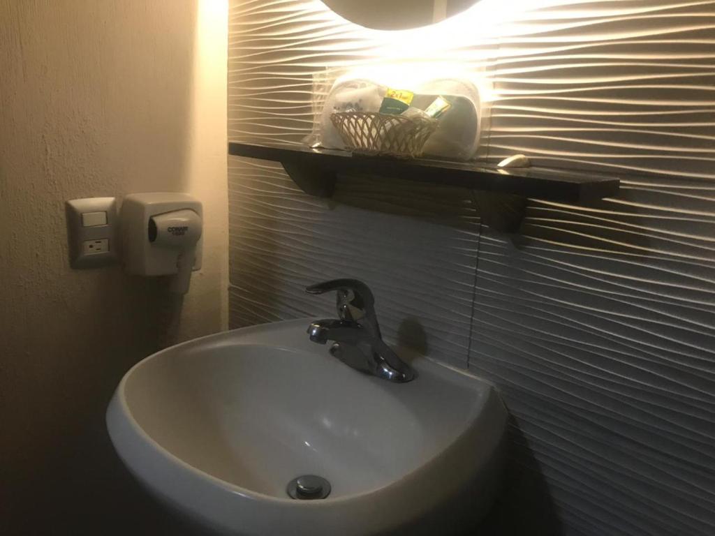 Koupelna v ubytování Hotel Expo Abastos