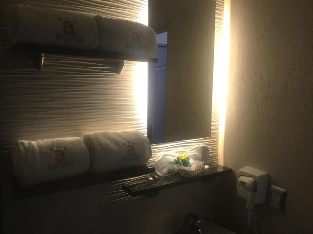 Postel nebo postele na pokoji v ubytování Hotel Expo Abastos