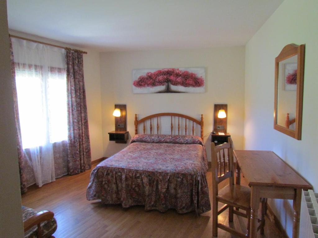 Postel nebo postele na pokoji v ubytování Hotel Las Nieves