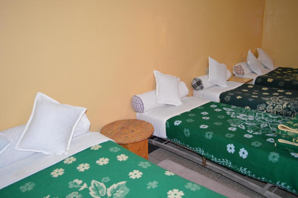 Postel nebo postele na pokoji v ubytování Hotel Atlas Ouarzazate