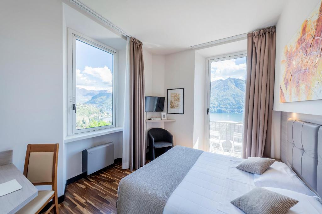 Postel nebo postele na pokoji v ubytování Hotel Asnigo