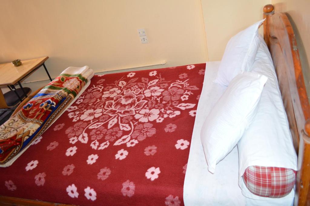 Postel nebo postele na pokoji v ubytování Hotel Atlas Ouarzazate