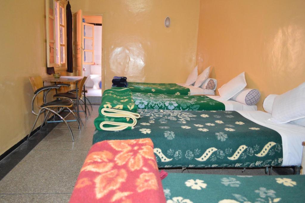 Postel nebo postele na pokoji v ubytování Hotel Atlas Ouarzazate