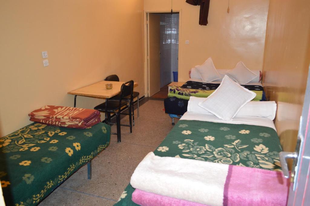 Postel nebo postele na pokoji v ubytování Hotel Atlas Ouarzazate