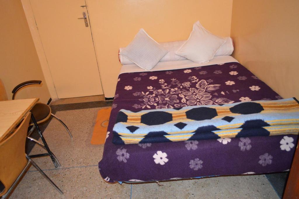 Postel nebo postele na pokoji v ubytování Hotel Atlas Ouarzazate