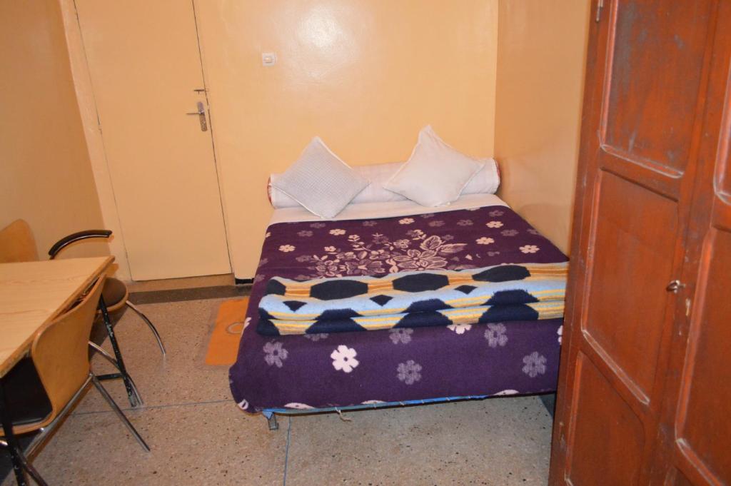 Postel nebo postele na pokoji v ubytování Hotel Atlas Ouarzazate