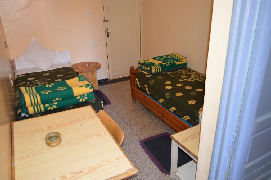 Postel nebo postele na pokoji v ubytování Hotel Atlas Ouarzazate