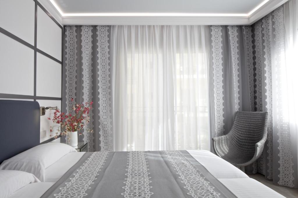 Posteľ alebo postele v izbe v ubytovaní Hotel Rosamar