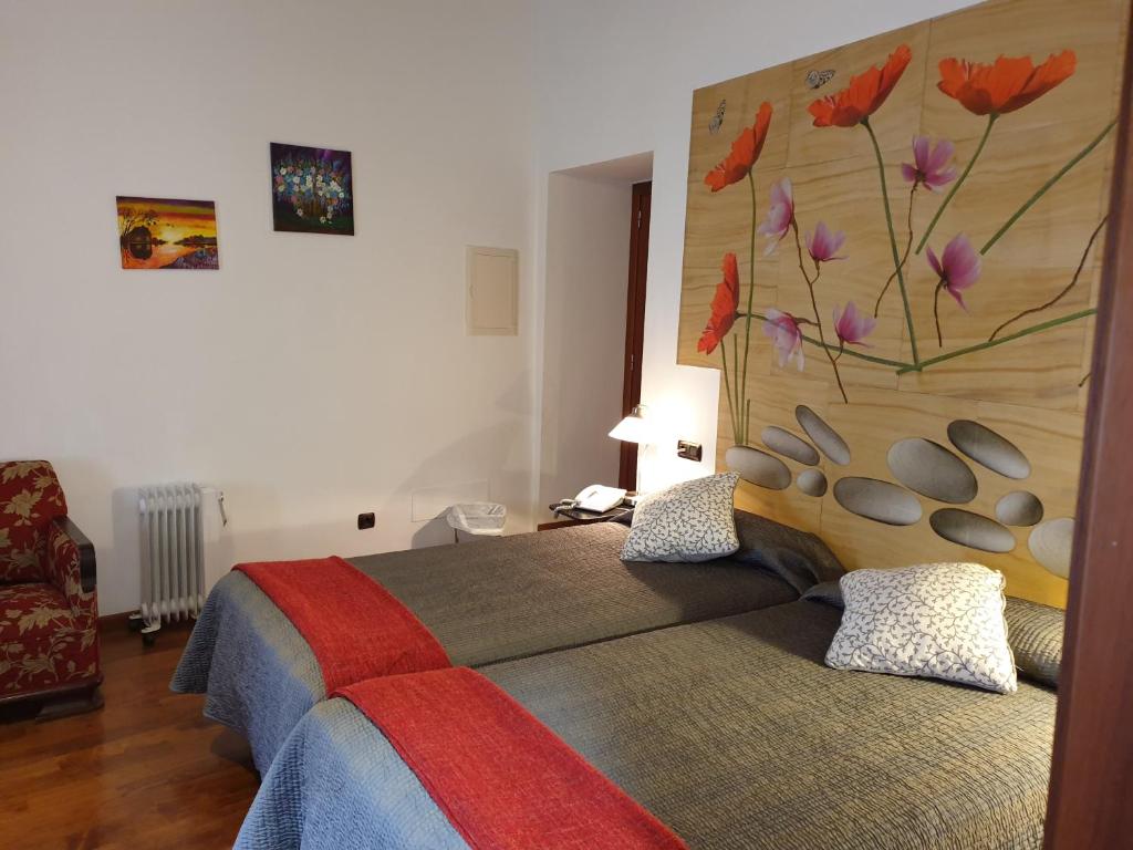 Postel nebo postele na pokoji v ubytování Hotel Segles - Turismo de Interior