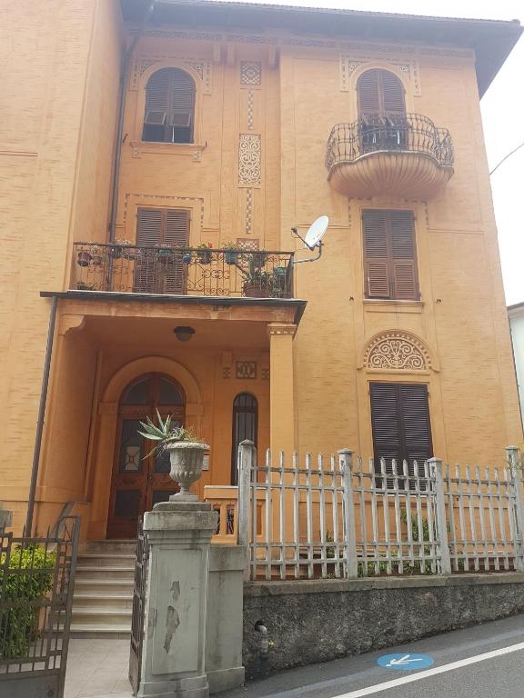 a building with a fence in front of it at Casa Brunello in La Spezia