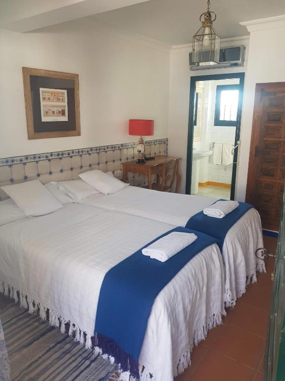 Posteľ alebo postele v izbe v ubytovaní Lince Casa Rural