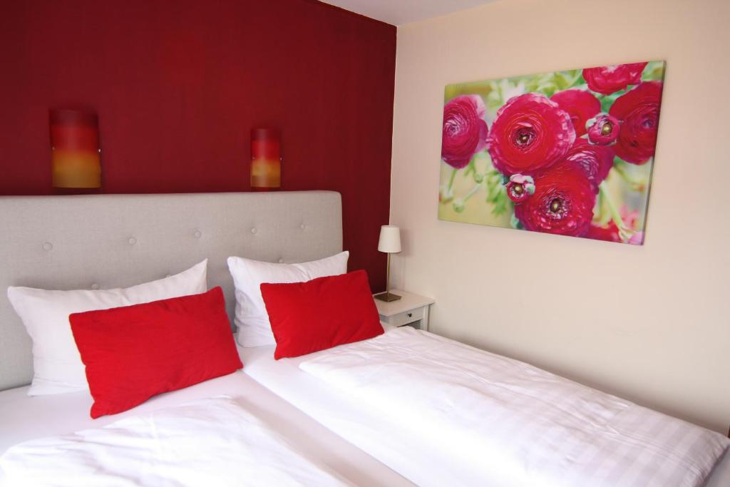 Postel nebo postele na pokoji v ubytování Hotel Heddernheimer Hof