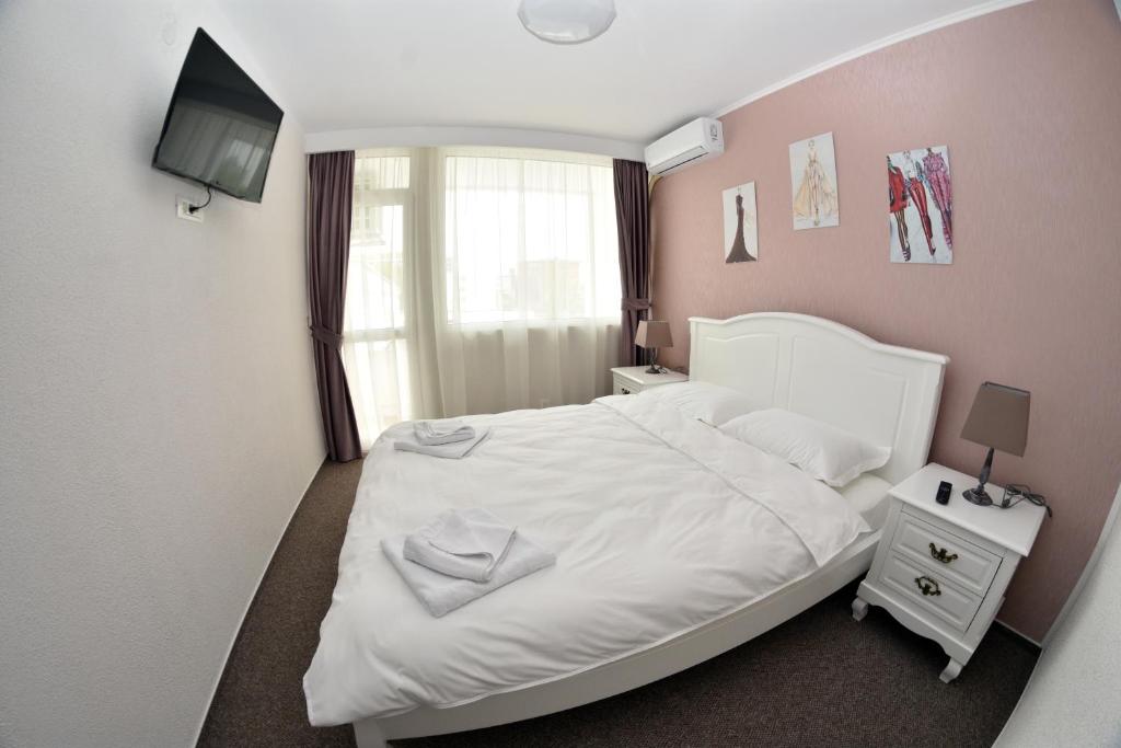 Postel nebo postele na pokoji v ubytování Hotel Victoria