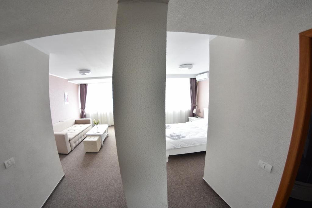 Postel nebo postele na pokoji v ubytování Hotel Victoria