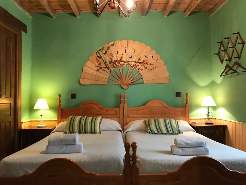 Posteľ alebo postele v izbe v ubytovaní La Casa del Abuelo Simón