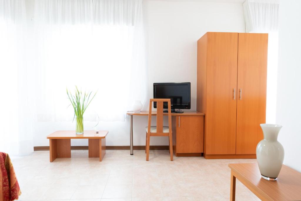 TV a/nebo společenská místnost v ubytování Hotel Nettuno