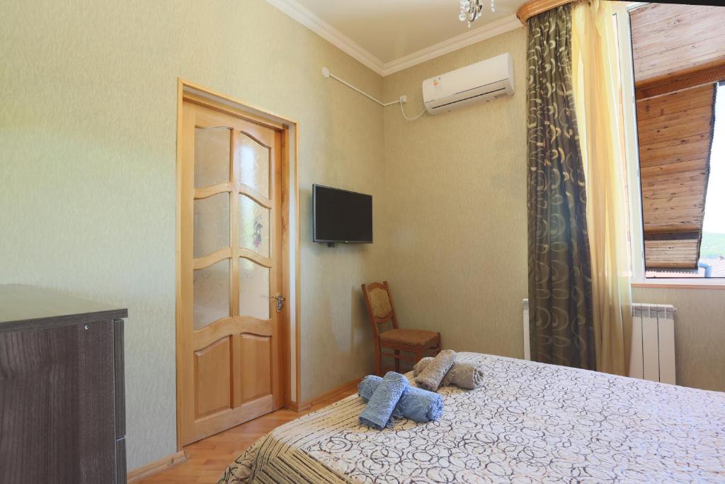 Postel nebo postele na pokoji v ubytování Guest House Eka & Gio