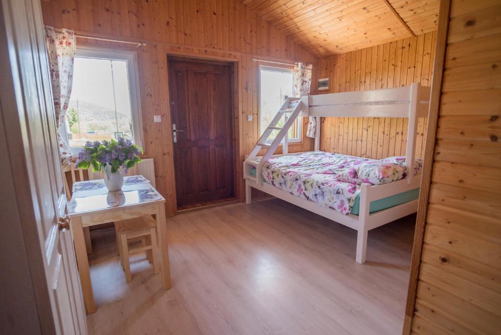 Postel nebo postele na pokoji v ubytování Domek Skowronek