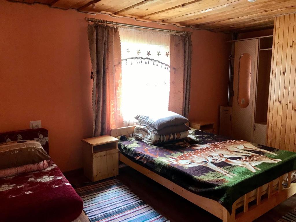 Postel nebo postele na pokoji v ubytování Rukavichka