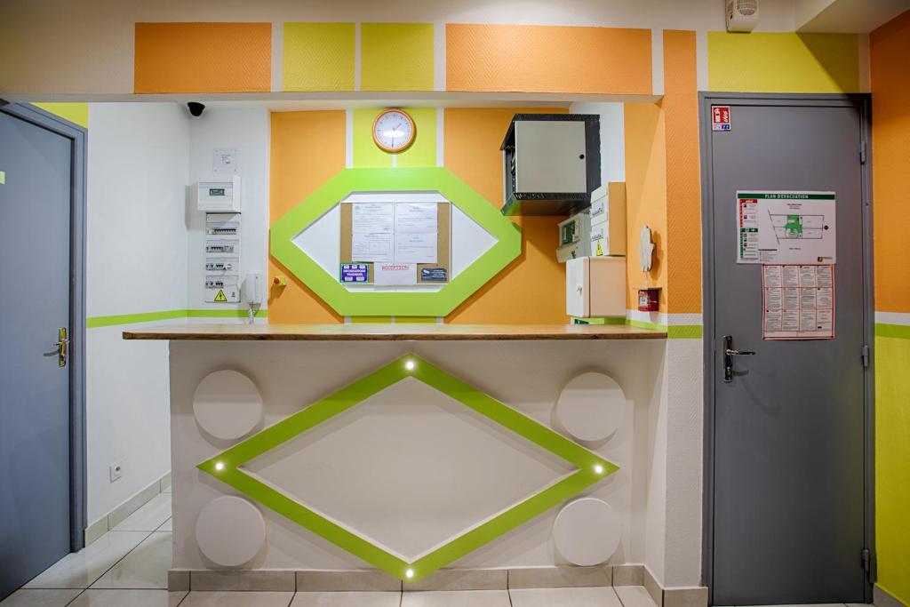 a hospital room with a counter and two doors at Hotel Monte-Cristo in Marseille