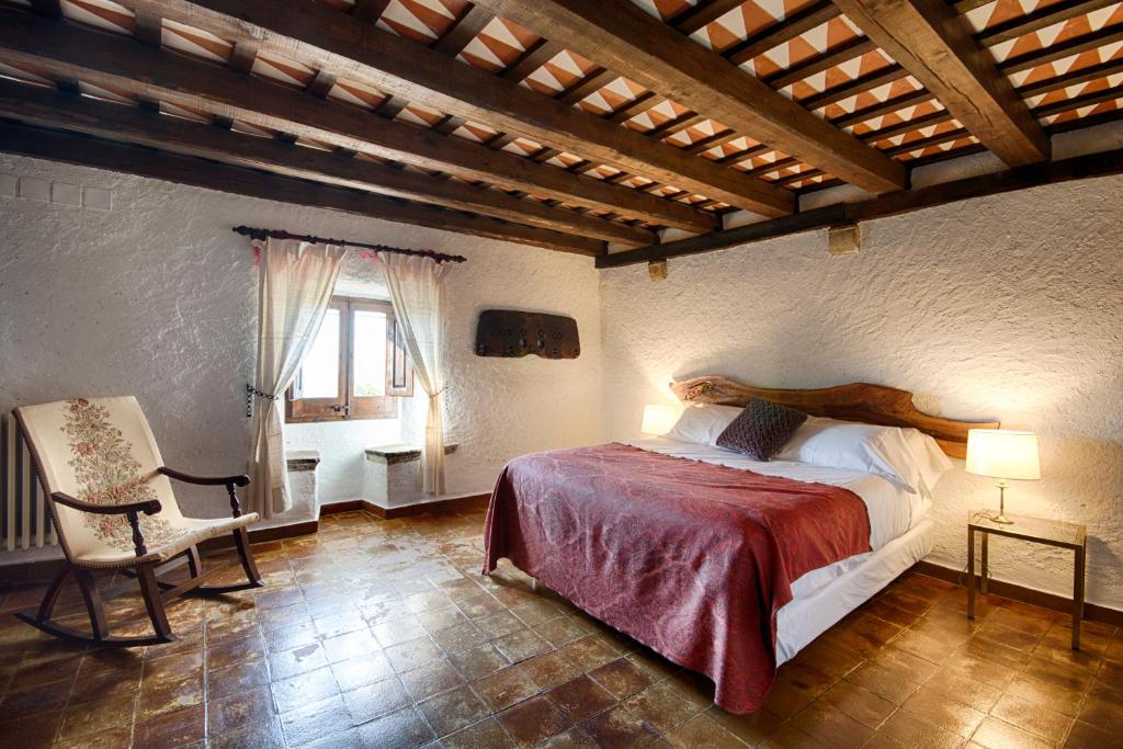 Postel nebo postele na pokoji v ubytování Masia Can Pou