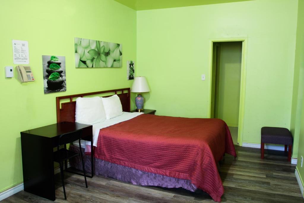 Postel nebo postele na pokoji v ubytování Hotel Casa Bella