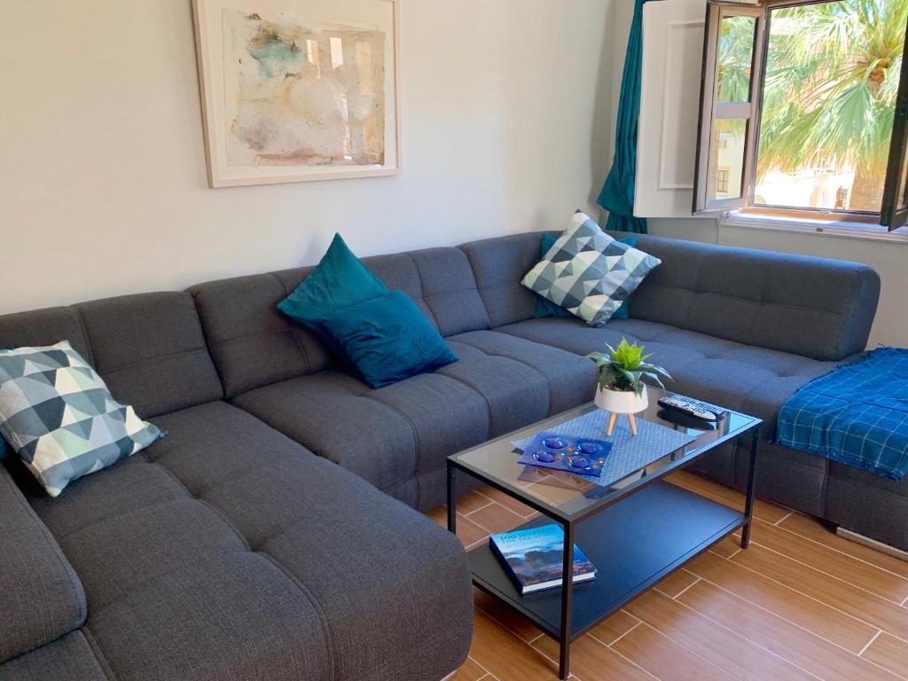 a living room with a couch and a table at Vilamoura 2 bed new apartment in Vilamoura