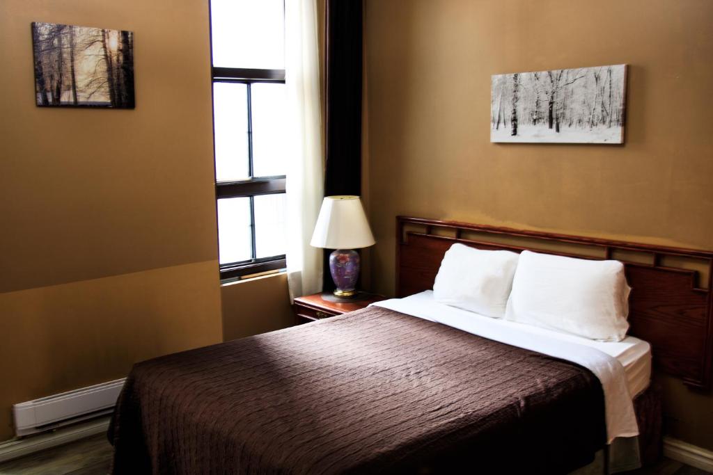 Postel nebo postele na pokoji v ubytování Hotel Casa Bella