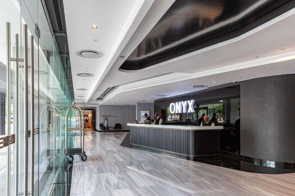 a lobby with a cash counter in a building at Luxury Onyx Penthouse with Sea Mountain Views by CTICC Cape Town in Cape Town
