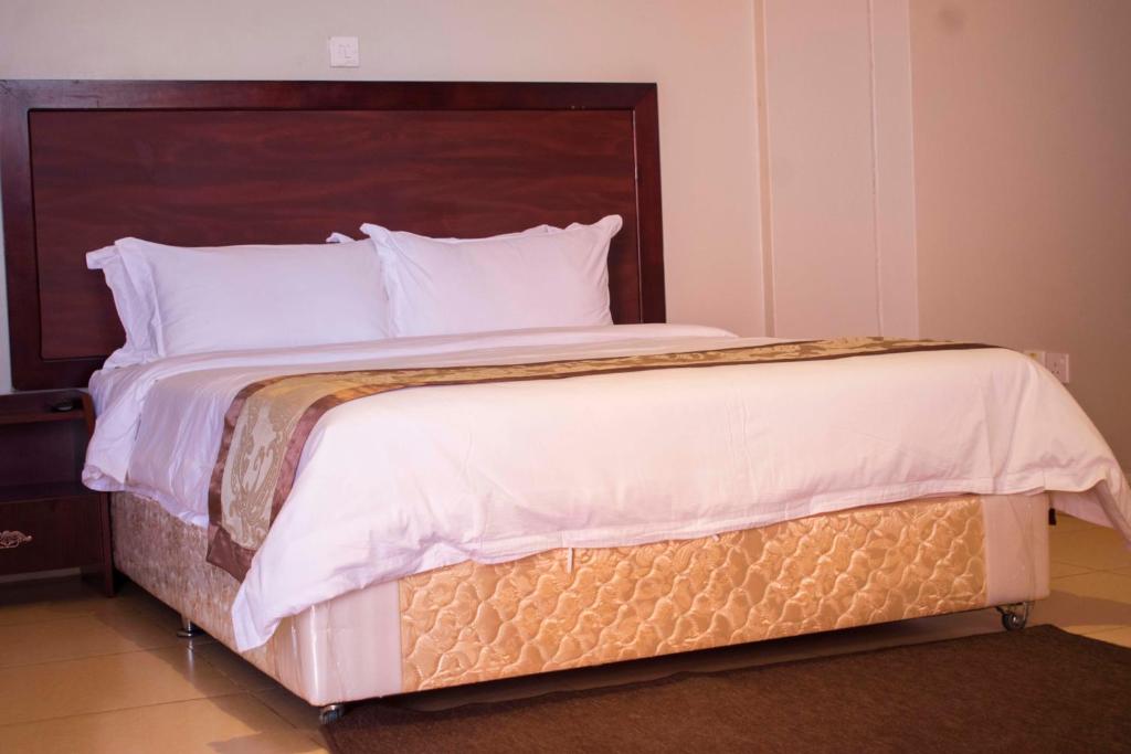 Postel nebo postele na pokoji v ubytování Easy View Hotel Mbarara