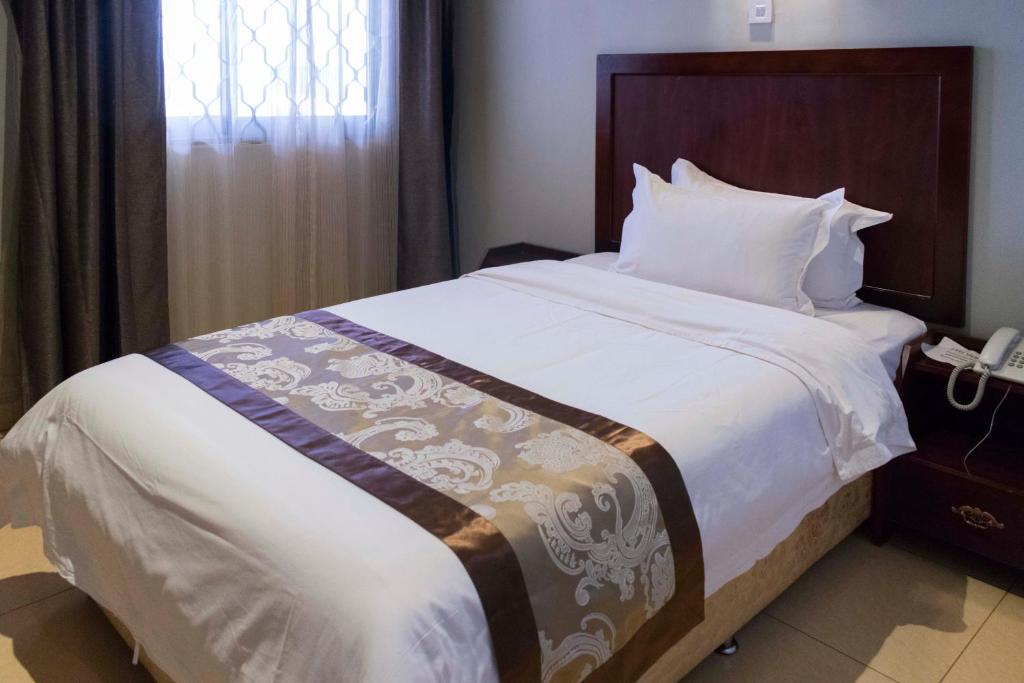 Postel nebo postele na pokoji v ubytování Easy View Hotel Mbarara