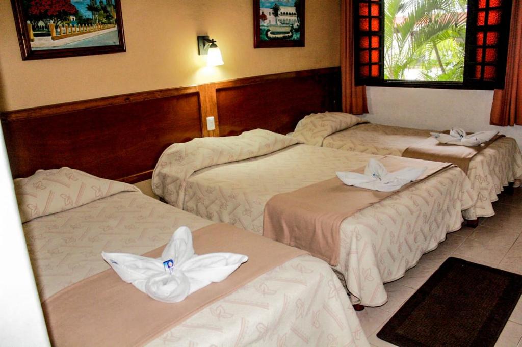 Postel nebo postele na pokoji v ubytování Hotel San Clemente