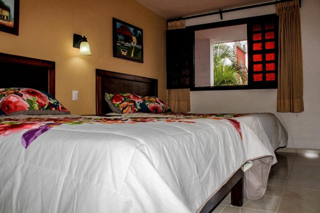 Postel nebo postele na pokoji v ubytování Hotel San Clemente