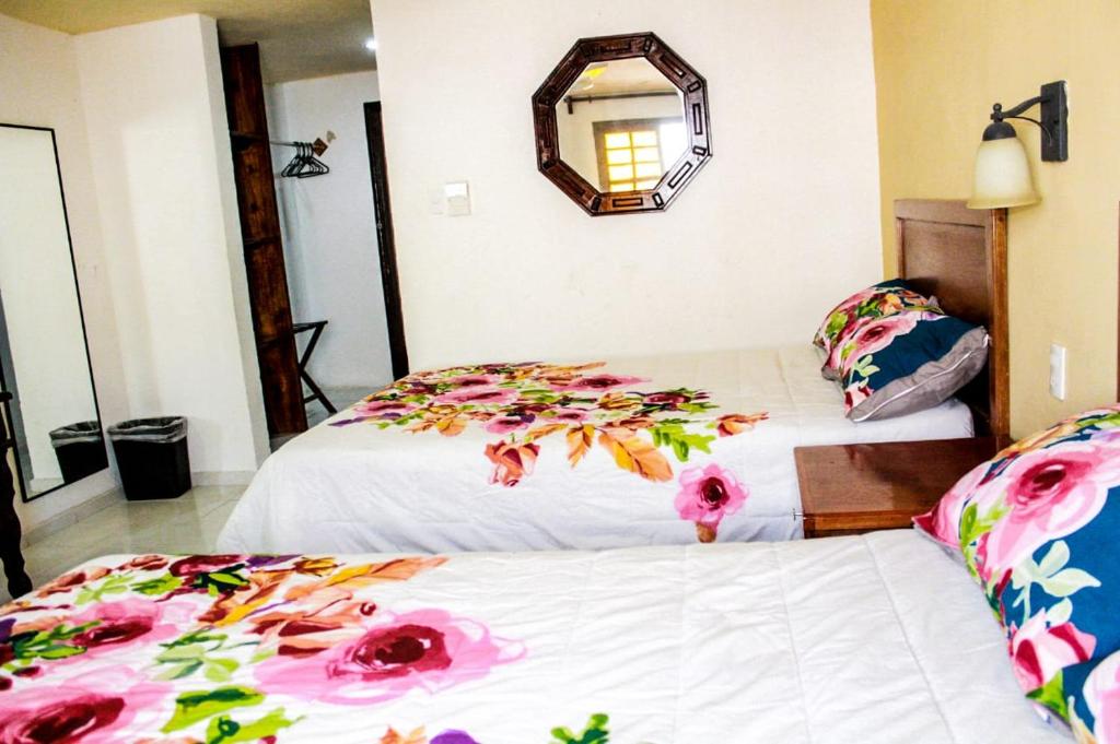 Postel nebo postele na pokoji v ubytování Hotel San Clemente